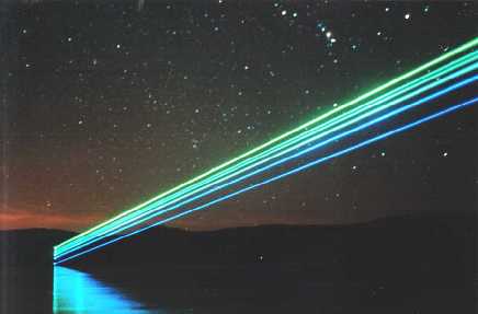 (Click To Zoom) nighttime photo of an argon laser beam (coherent cr52, 5-watt) scanning out over a lake (courtesy of laserist John Wieczorek)